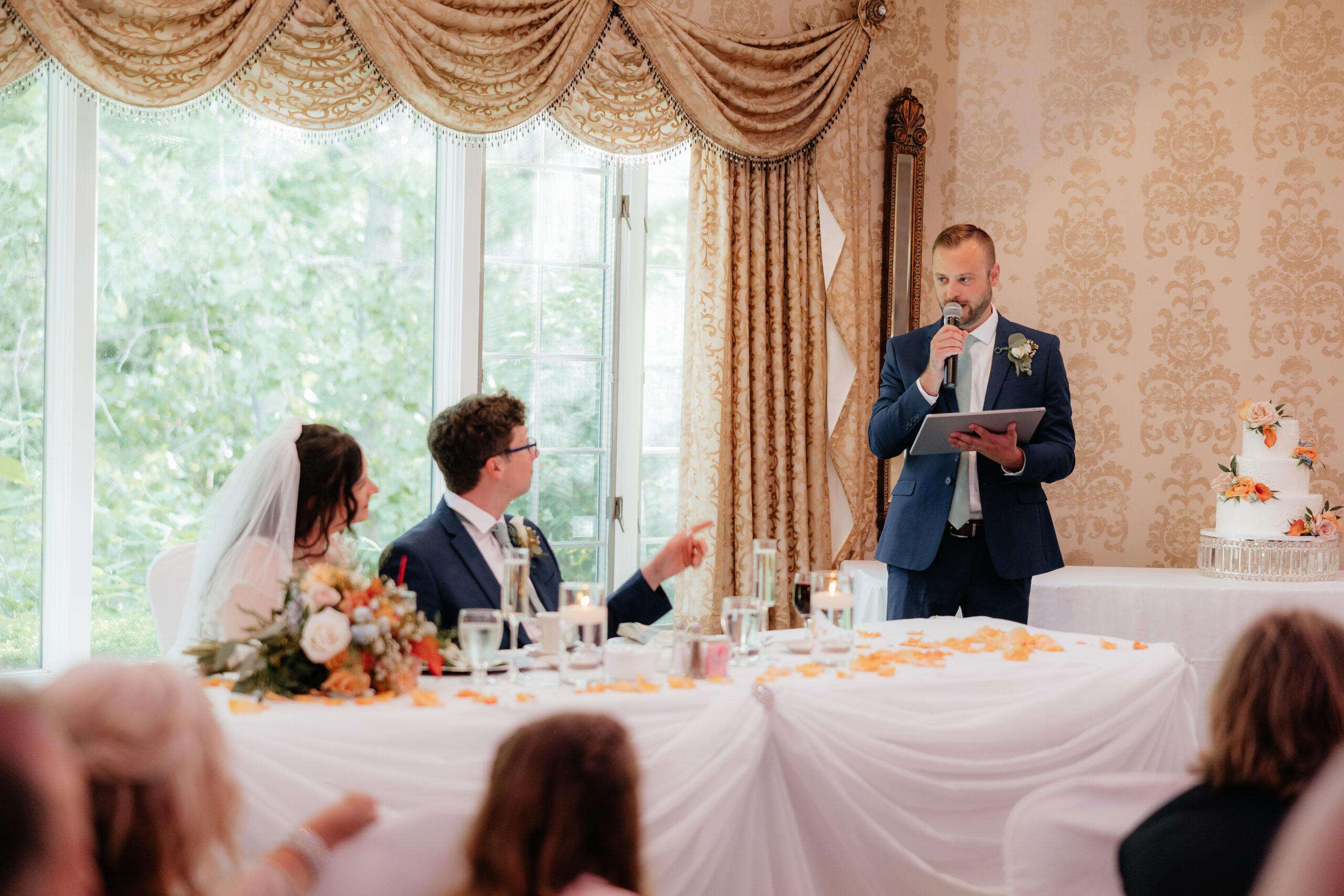 The best man gives a speech in the Grand Ballroom at Kloc's Grove in Buffalo, New York.