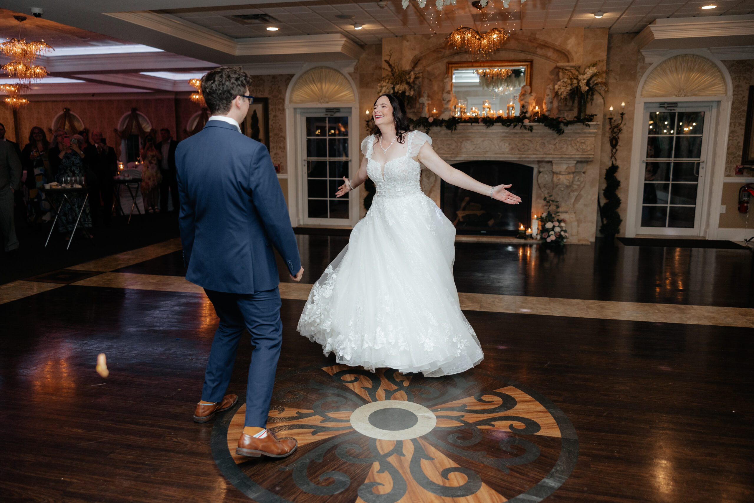 A bride and groom enjoy their first dance in the Grand Ballroom at Kloc's Grove wedding venue in Buffalo, New York.