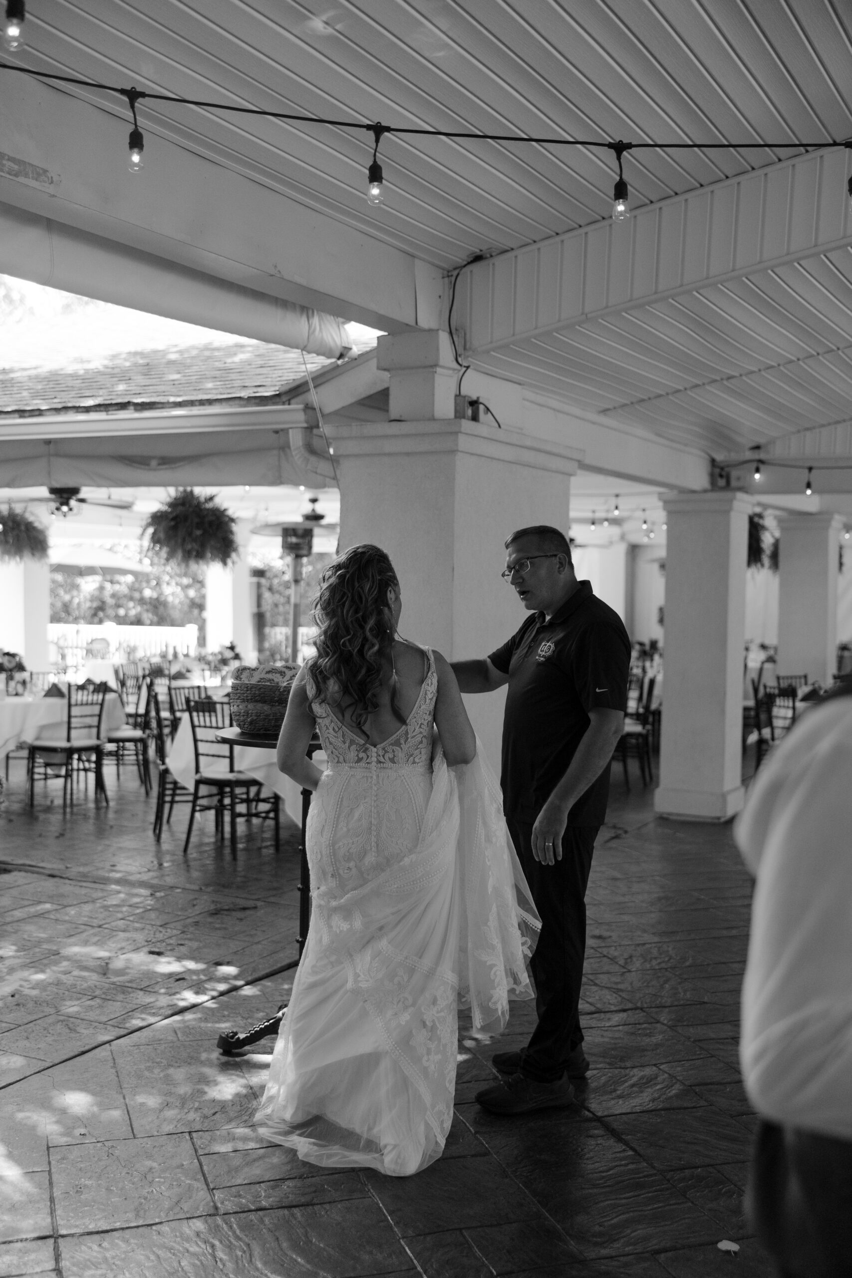 A bride speaking with the general manager of Kloc's Grove wedding venue in Buffalo, New York.