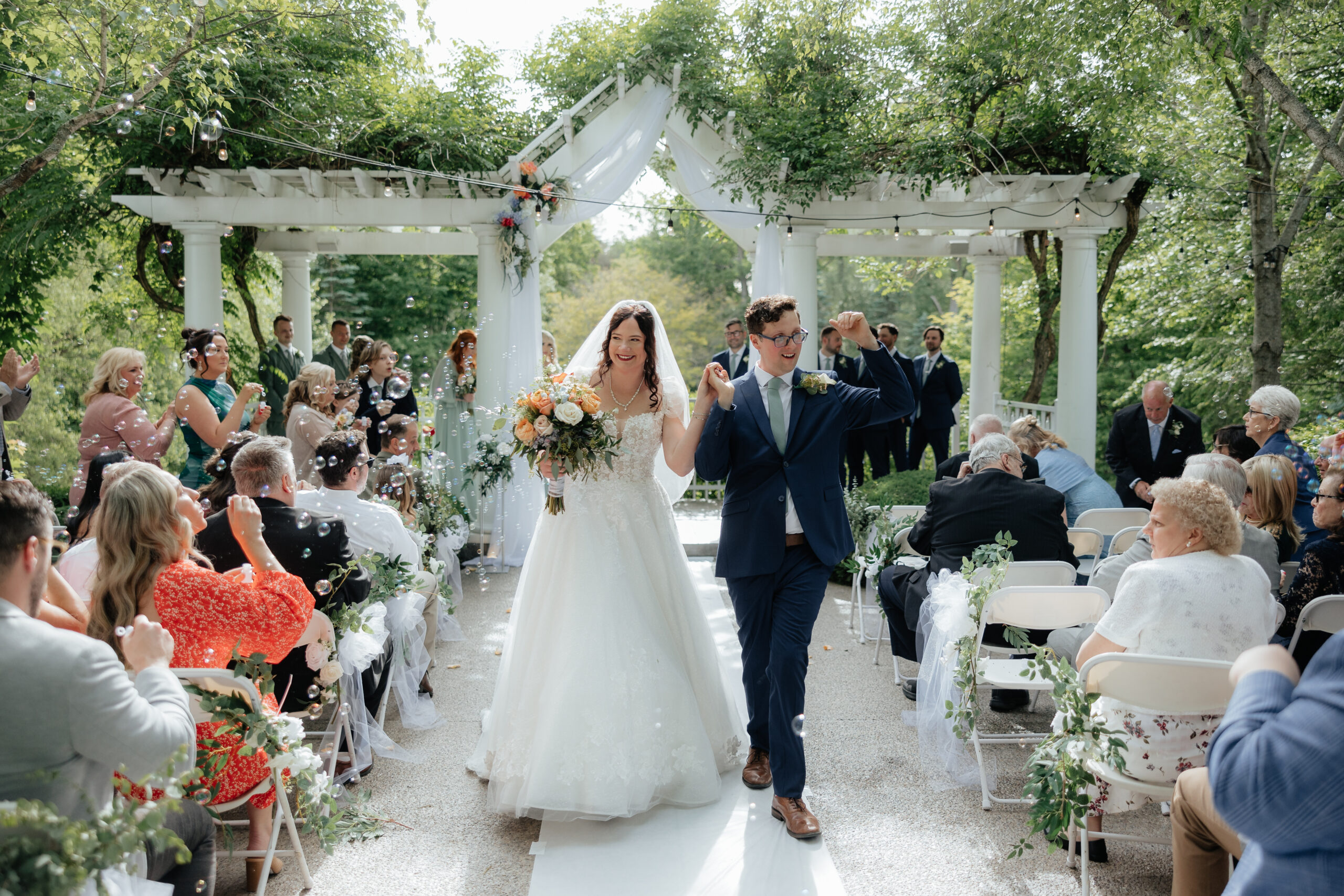 Bride and groom conclude outdoor ceremony at Kloc's Grove